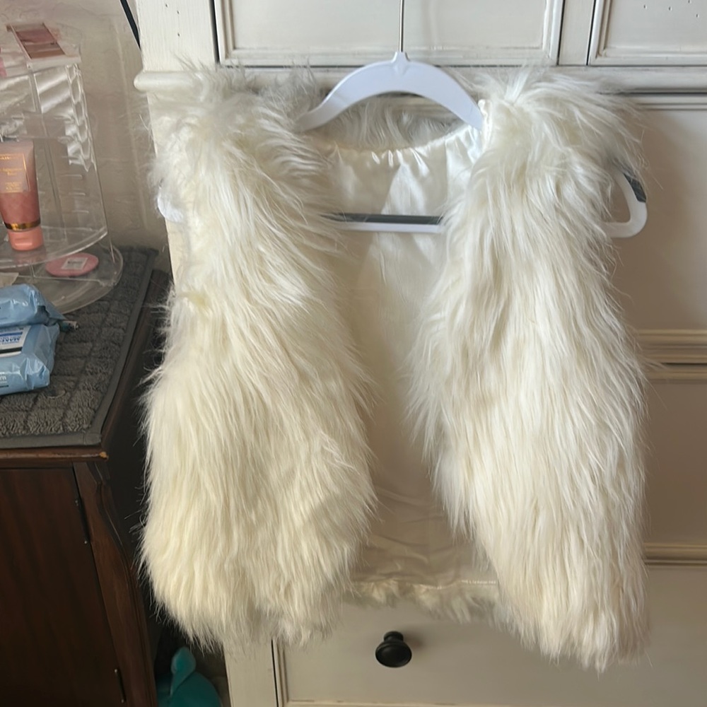 White fur vest